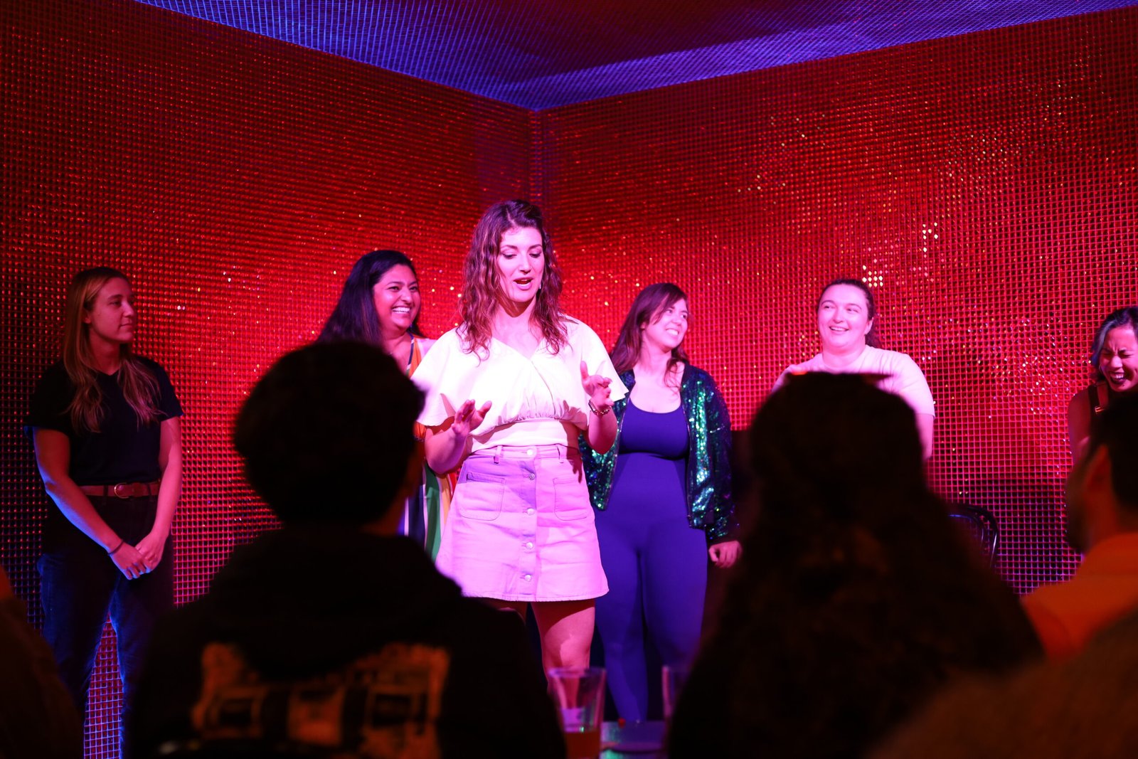 An ensemble of IMPRIDE performers sharing the stage