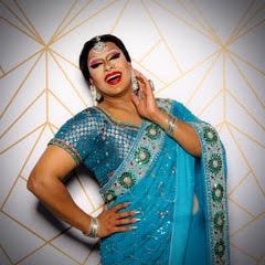 Lady Bushra wearing a turquoise sari